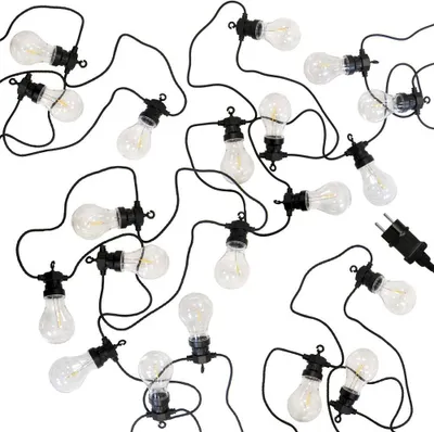 A string of LED lights with clear bulbs and black cords, arranged in a scattered pattern on a white background.