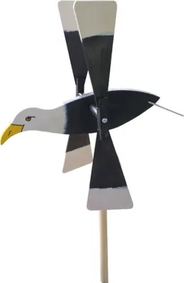 A wooden wind spinner shaped like an eagle, mounted on a wooden pole.