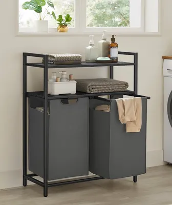 A laundry rack with two baskets and two shelves, placed near a window and a washing machine.