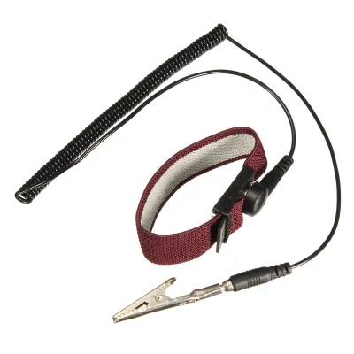 An anti-static wrist strap with a coiled cord and a crocodile clip.