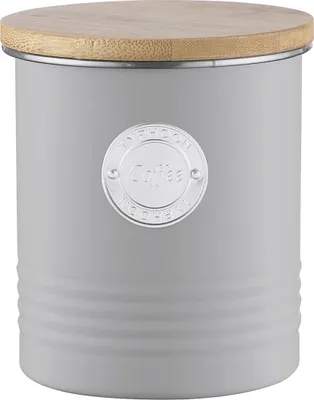 A close-up studio shot of a gray coffee canister with a wooden lid.