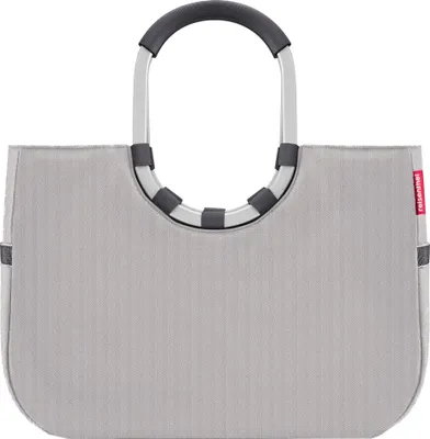 A light gray shopping bag with a herringbone pattern and black and silver handles.