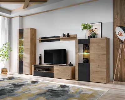 A modern living room furniture set, including a TV stand, display cabinets, and shelving, arranged against a wall.