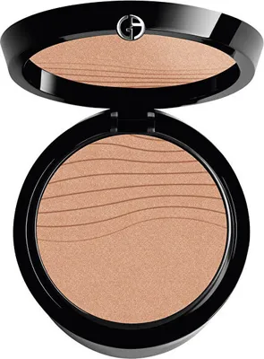 A close-up studio shot of an open compact powder.