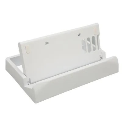 A white plastic stand for a handheld gaming device, shown from a slightly elevated side angle against a white background.