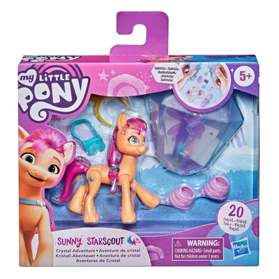 A toy pony and accessories in its packaging.
