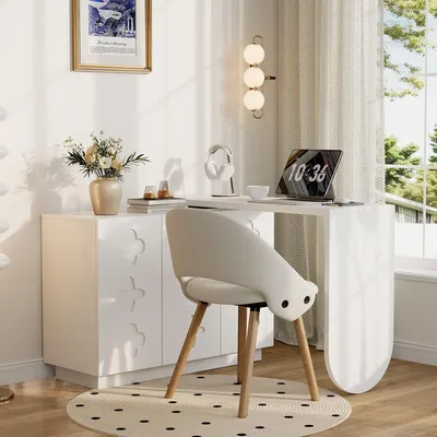 A modern home office setup with a white desk, chair, and cabinet.