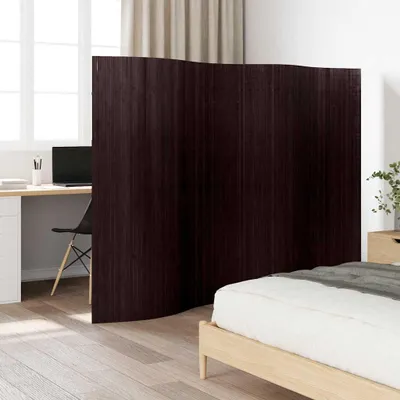 A room divider is placed between a desk area and a bed, suggesting a bedroom or studio apartment setting.