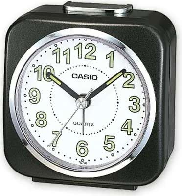 A close-up studio shot of a black Casio alarm clock.