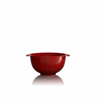 A red colander is shown in the center of the image against a white background.