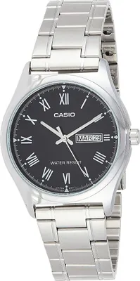 A close-up studio shot of a men's Casio watch with a black dial and silver metal band.
