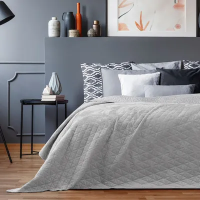 A bedroom scene with a bed and decorative items.