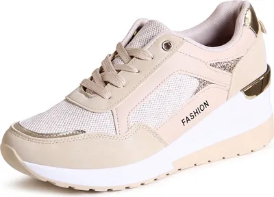 A single beige wedge sneaker is shown against a white background.