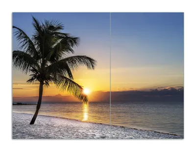 Produktbild von Wallario Herdabdeckplatte aus Glas, Größe 70 x 52 cm 2-teilig, Motiv Palme am Strand - Sonnenuntergang über dem Meer