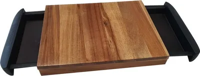 A wooden cutting board with two black pull-out drawers underneath, presented on a white background.
