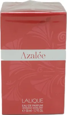 A close-up shot of a red perfume box with floral patterns and text.