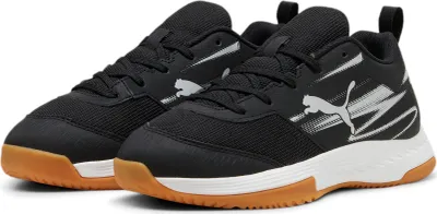 A pair of black Puma sneakers with white accents and a gum sole, shown from a diagonal angle against a white background.