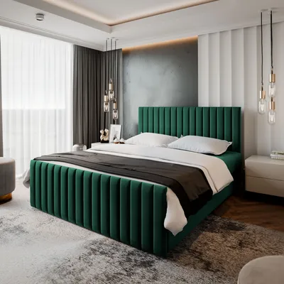 A bedroom with a green upholstered bed as the main focus.