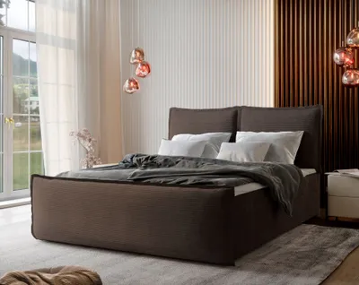 A bedroom scene featuring a large bed with bedding, bedside table, and decorative lighting.