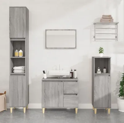 A bathroom vanity set with cabinets and a mirror.