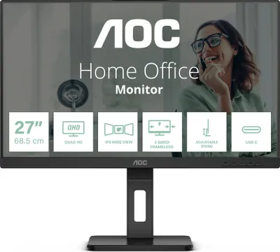 AOC monitor with feature callouts and a woman in the background.