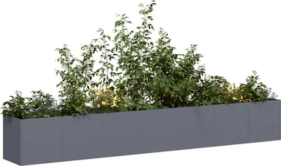 A long, rectangular planter filled with green plants and some yellow flowers, set against a white background.