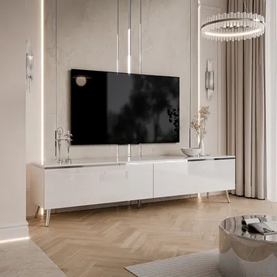 A modern living room with a TV stand and television.