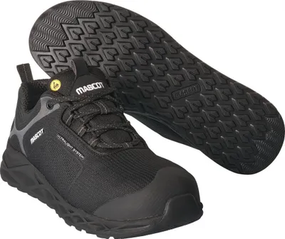 A black safety shoe and its sole are displayed against a white background.