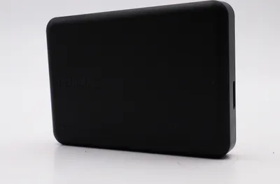 A black external hard drive is shown against a white background.