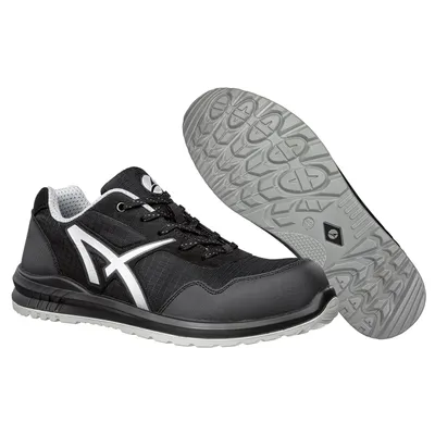 A pair of black safety shoes with white accents, shown from a slightly elevated side angle with the sole of one shoe displayed separately.