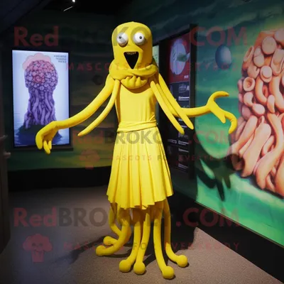Imagen del producto de Personaje REDBROKOLY de disfraz de mascota de Medusa amarillo vestido con un vestido tubo y gemelos