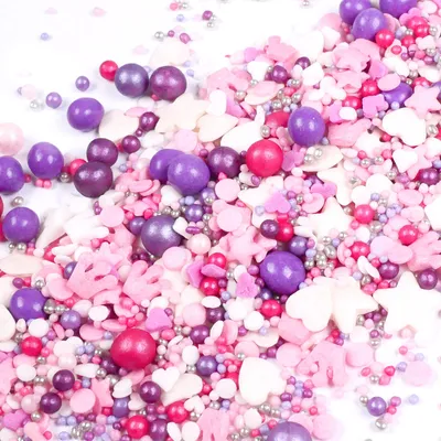 Produktbild von Streuselheld Prinzessin 80g pink lila Streuselmix mit Kronen, Herzen und Schokoladenkugeln als essbare Streudeko für Tortendeko, Cupcakes und Kekse