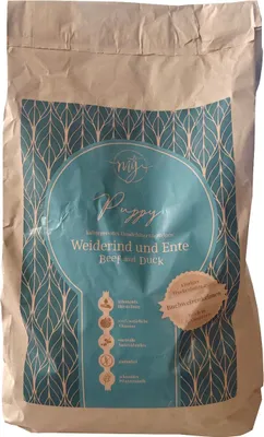 A bag of dog food with a decorative pattern and product information.