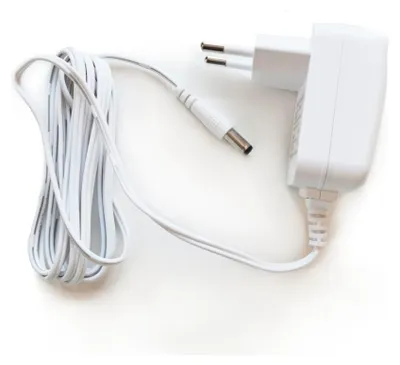 A white power adapter with a coiled white cable and a European plug.