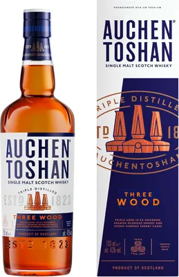 A bottle of Auchentoshan Three Wood Single Malt Scotch Whisky and its packaging.