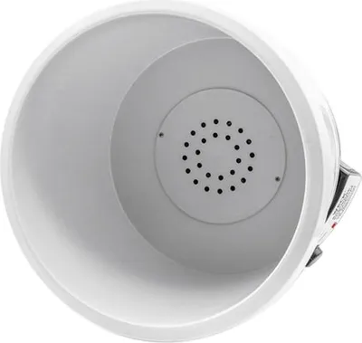 The image shows the inside of a white electric preserving pot with a grey perforated insert.
