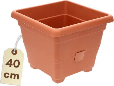 A square terracotta-colored plastic planter with a tag indicating its size.