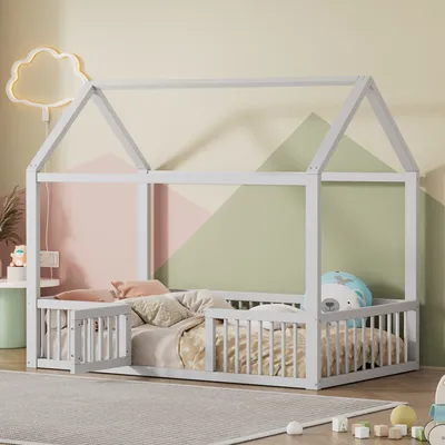 A child's bedroom with a house-shaped bed.