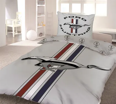 A bedroom with a Ford Mustang themed duvet cover and pillow.