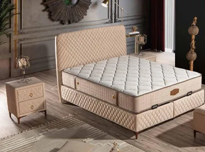 Image de Lit en bois textile beige avec matelas moderne et confortable