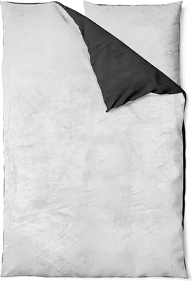A folded duvet cover and pillowcase set, showing the reversible sides.