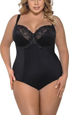 A woman is wearing a black shapewear bodysuit.