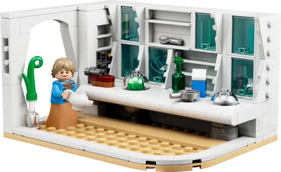 A LEGO® set depicting a kitchen scene with a minifigure.