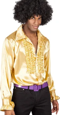 A man wearing a gold ruffled shirt and a purple belt.