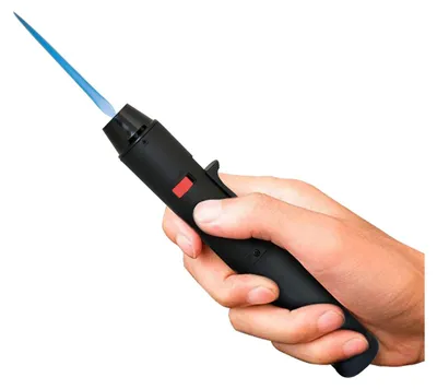 A hand holding a black butane torch lighter with a blue flame.