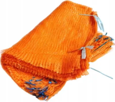 A stack of orange mesh bags, tied with blue string.