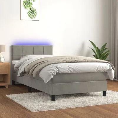 Imagen del producto de Cama con somier y colchón Living Store, color gris claro, con iluminación LED, dimensiones 90x190 cm, tapizada en terciopelo