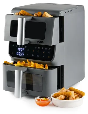 A gray dual-basket air fryer is shown with french fries and spring rolls.