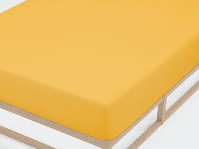 A close-up view of a yellow fitted sheet on a bed frame.