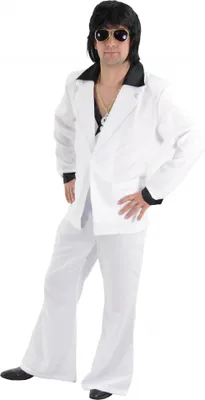 A man wearing a white disco suit with a black collar, black shirt, gold chain, and sunglasses.